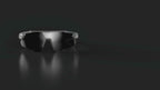 Black polarized sports glasses displayed against a dark background
