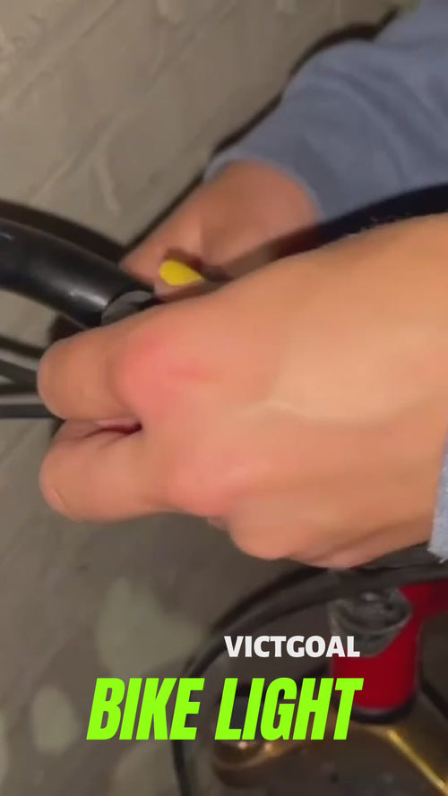 Close-up of a rider fastening the 2-in-1 bike light to a mounting strap
