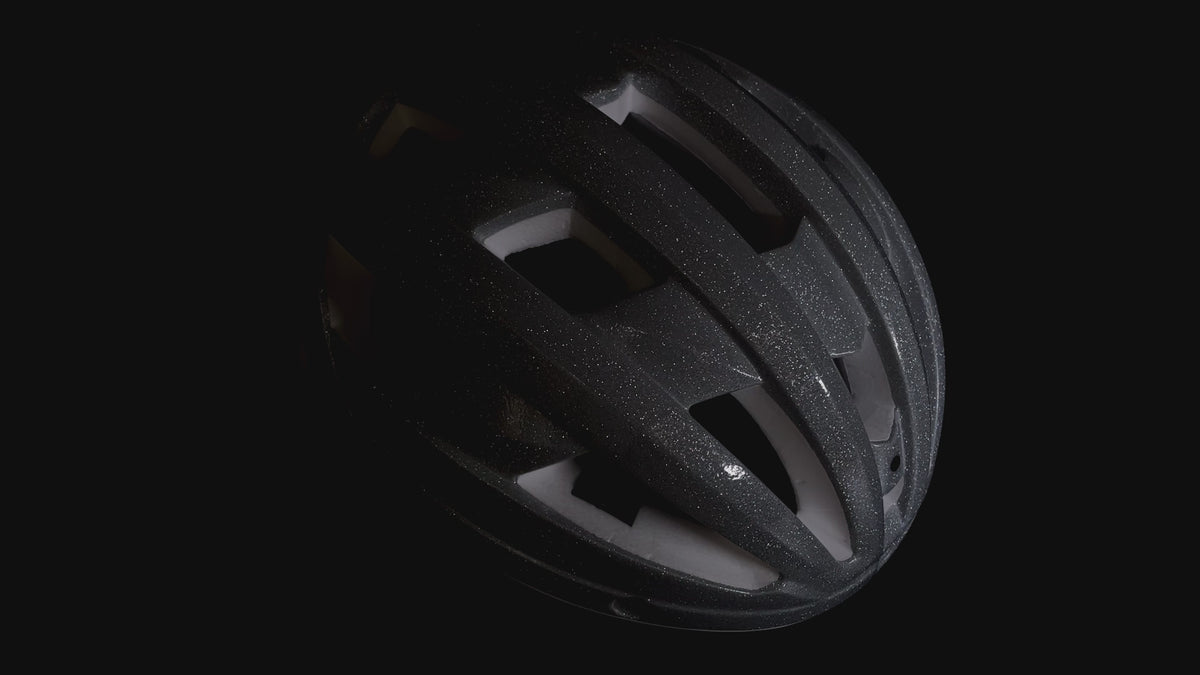 Matte black GLITTER road bike helmet shown from the side under studio lighting